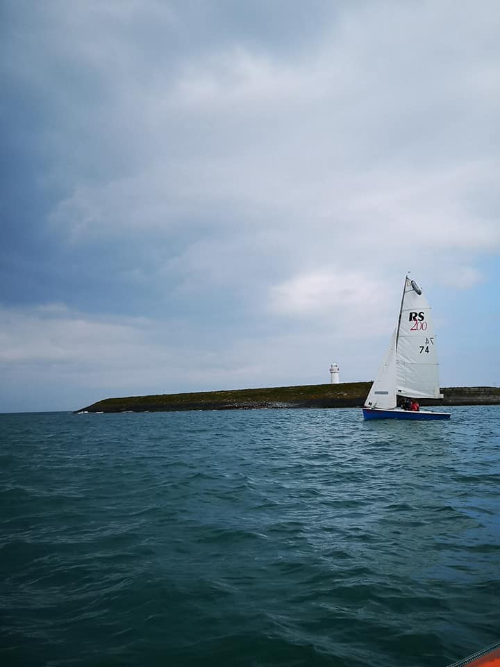 RS200 sailing with Donaghadee Lighthouse in background